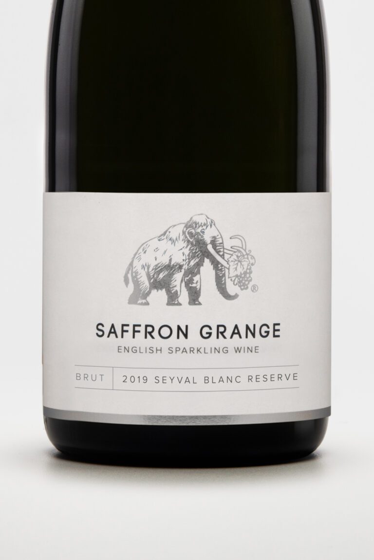 Photo shows close up of sparkling wine bottle label featuring a woolly mammoth